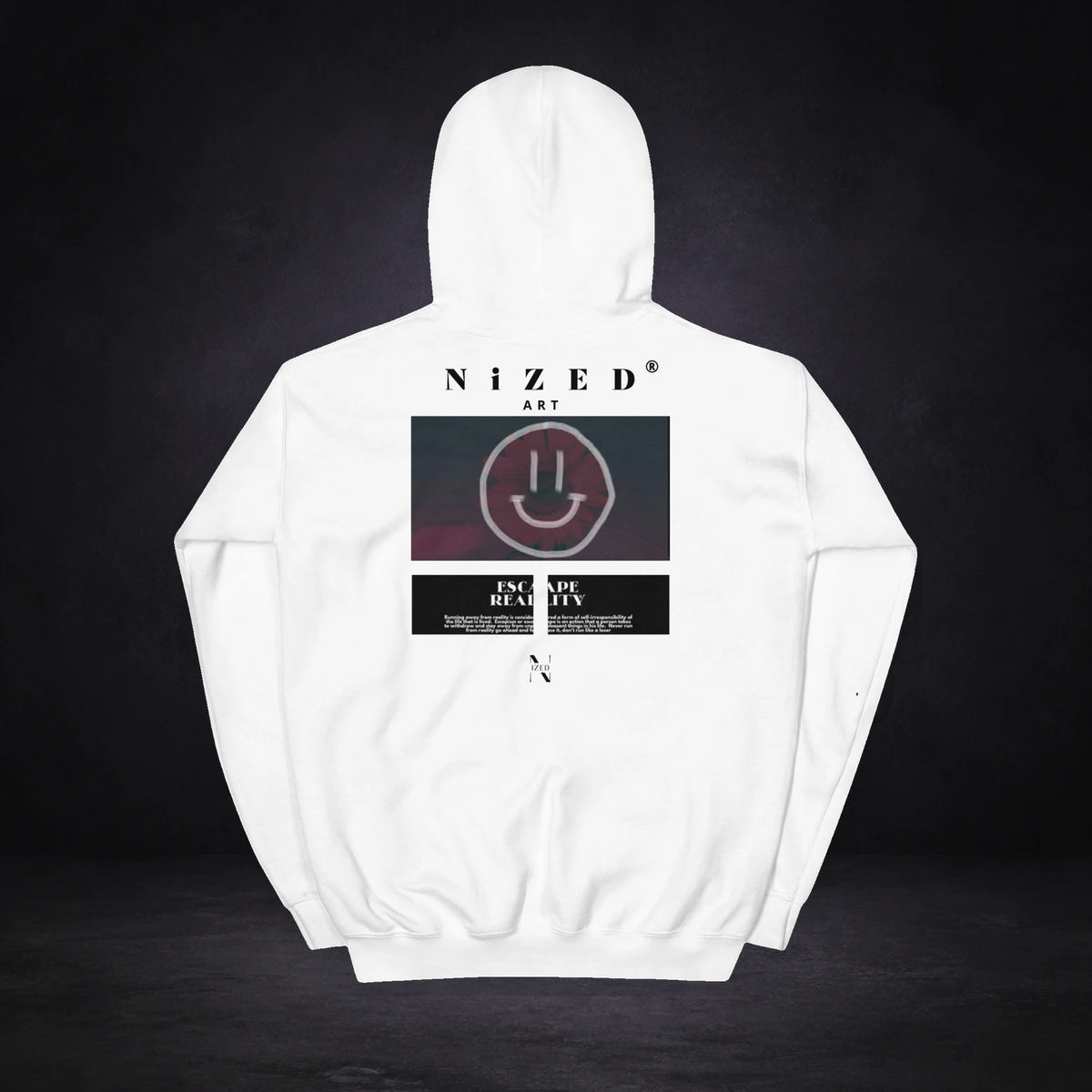 Escape Reality Hoodie von NiZED, Rückansicht mit Designprint vor dunklem Betonhintergrund