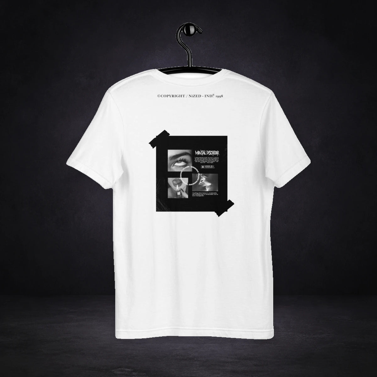 Reckless Graphic T-Shirt von NiZED, Rückansicht mit Designprint vor dunklem Betonhintergrund