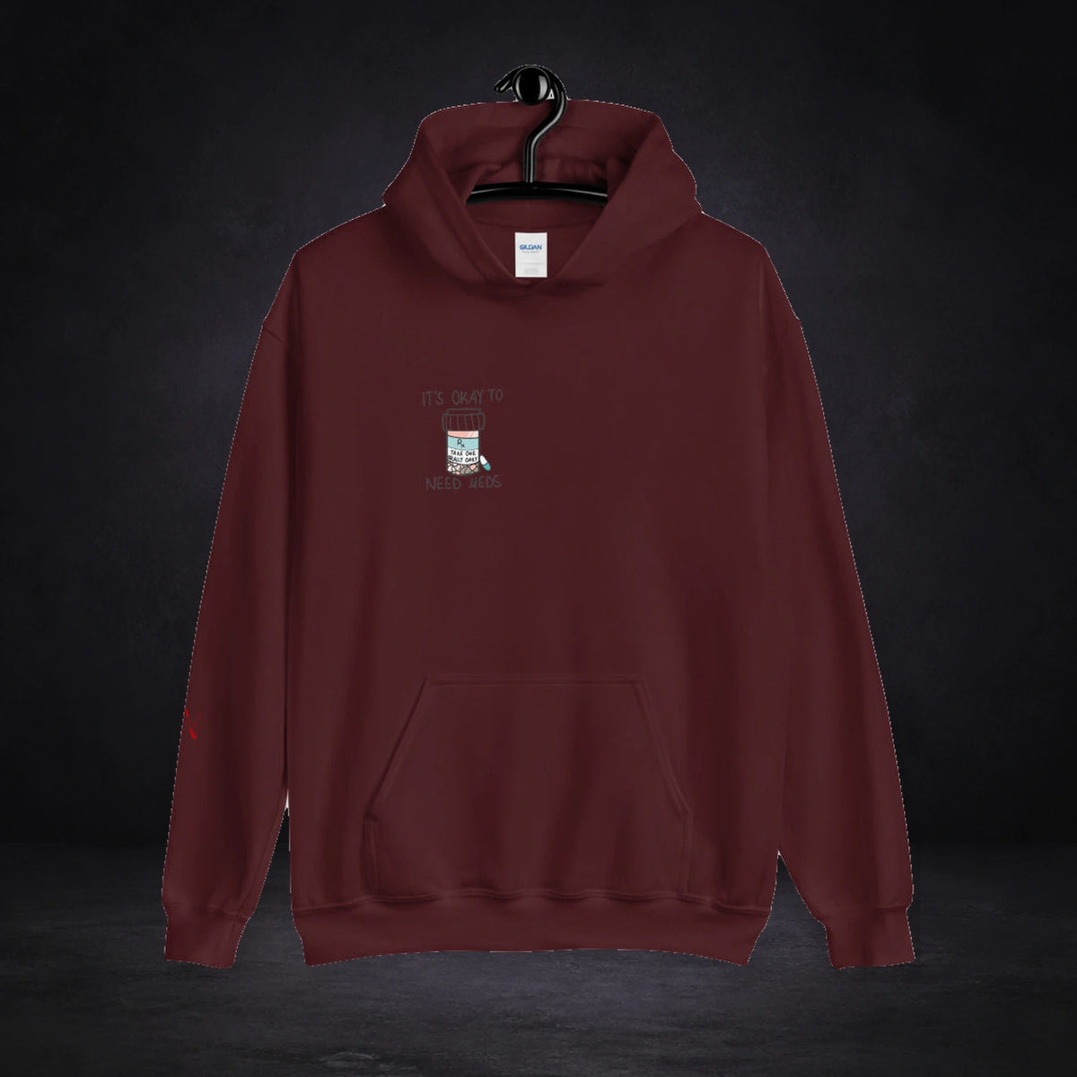 Ritalin x Fake Society Hoodie von NiZED, Vorderansicht mit Designprint vor dunklem Betonhintergrund