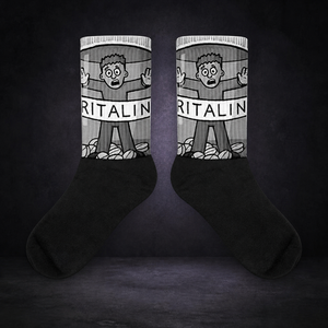 Ritalin Statement Socken von NiZED im dunklen Betonraum – sauberes Kollektionscover
