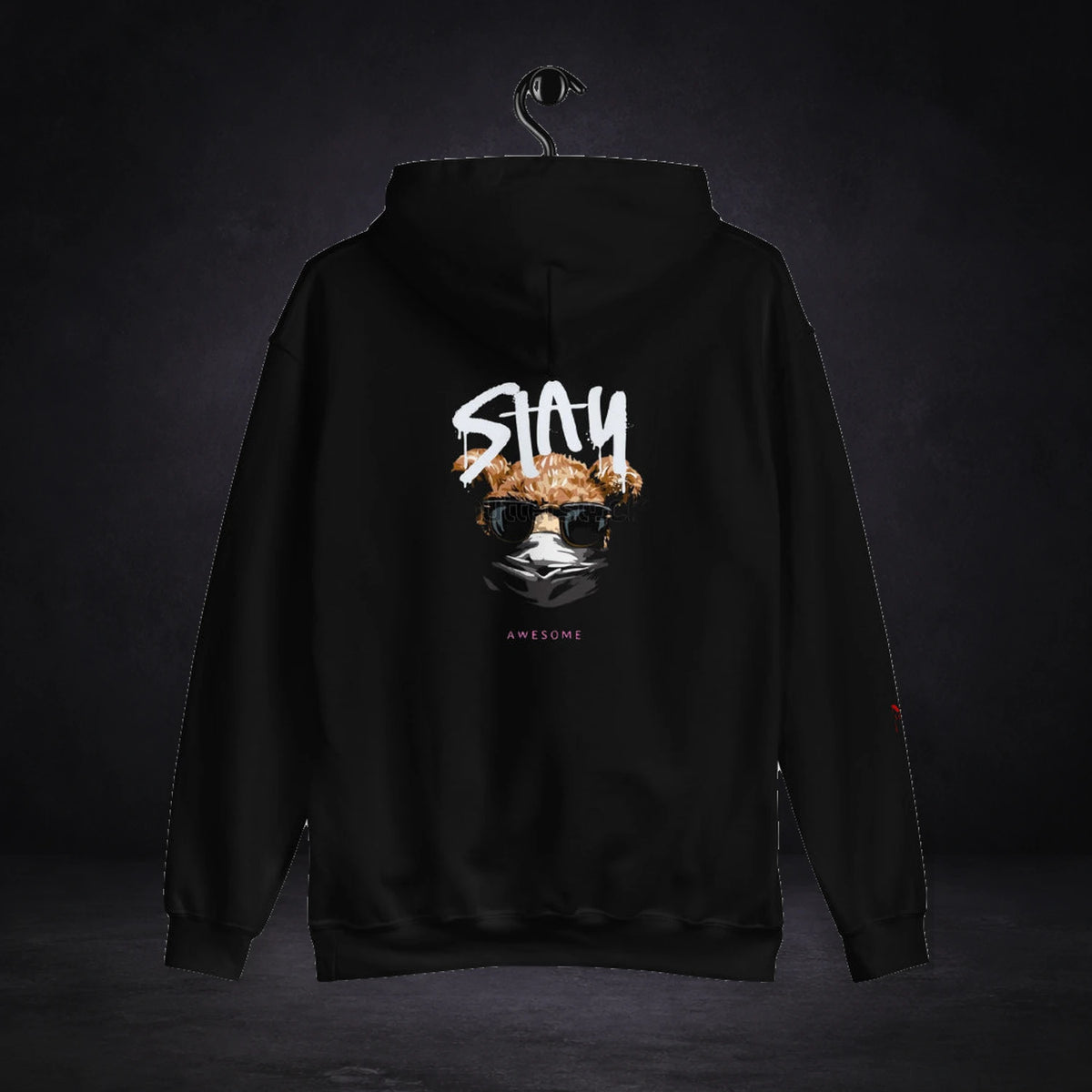 Stay Awesome Hoodie von NiZED, Rückansicht mit Designprint vor dunklem Betonhintergrund