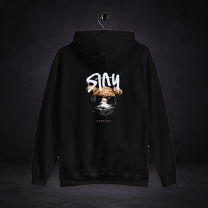 Stay Awesome Hoodie von NiZED, Rückansicht mit Designprint vor dunklem Betonhintergrund