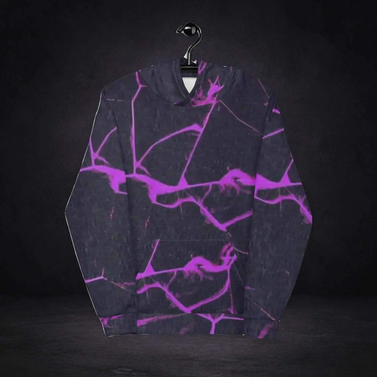 Xyphez Graphic Hoodie von NiZED, Vorderansicht mit All-over-Print vor dunklem Betonhintergrund